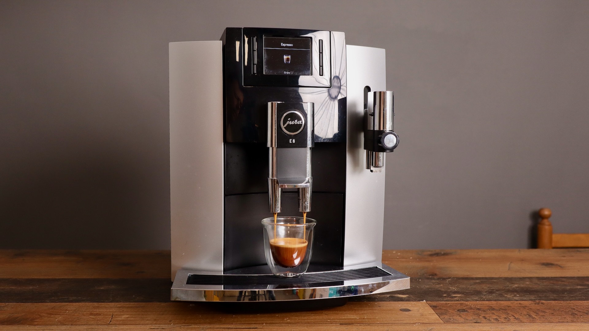 Jura E8 espresso machine pulling an espresso